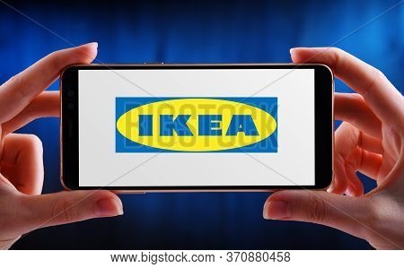 Poznan, Pol - May 21, 2020: Hands Holding Smartphone Displaying Logo Of Ikea A  Multinational Group 
