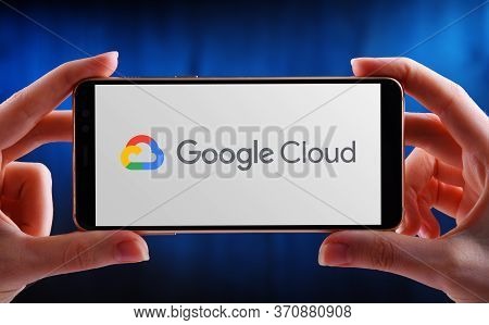 Poznan, Pol - May 21, 2020: Hand Holding Smartphone Displaying Logo Of Google Cloud Platform (gcp), 
