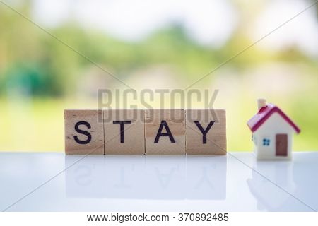 The Letters In The Wooden Blocks Say Stay At Home. Controlling Yourself At Home Is A Preventive Meas