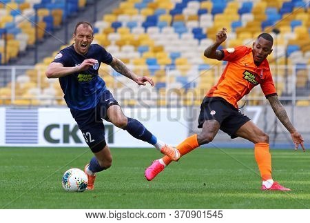 Kyiv, Ukraine - June 6, 2020: Fernando Of Shakhtar Donetsk (r) Fights For A Ball With Maksym Imereko
