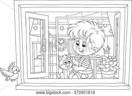 Cheerful Little Boy Playing With A Cute Small Kitten On A Windowsill In His Nursery Room And Looking