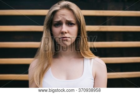Young Caucasian Teenager With Blonde Hair Feeling Headache