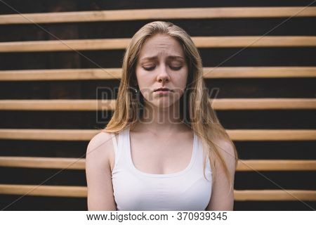 Young Caucasian Teenager With Blonde Hair Feeling Headache