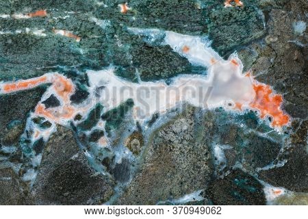 Texture Of Green Breccated Volcanic Rock With Streaks Of White Chalcedony And Red Zeolites