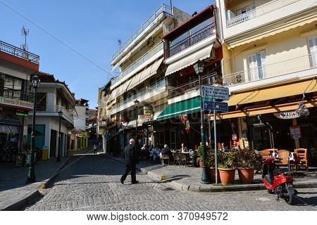 Litochoro, Greece - April 12, 2015: People Drink Coffee Outdoors In The Center Of The Village Of Lit