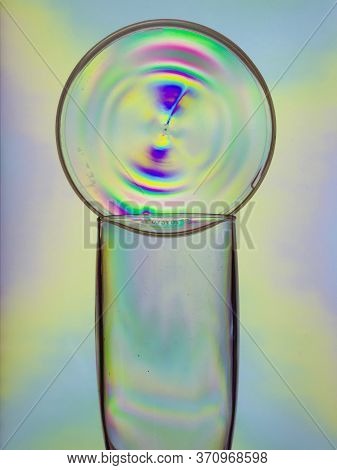 Empty Champagne Plastic Glass, Colorful Circle On Top