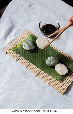 Hand Use Chopstick Pinch Chinese Chive Dumpling, (kanom Gui Chai)mixture Of Flour With Chives Garlic