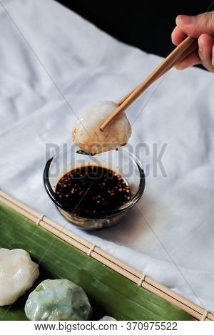 Hand Use Chopstick Pinch Chinese Chive Dumpling, (kanom Gui Chai)mixture Of Flour With Chives Garlic