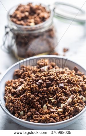 Bowl Of Muesli With Dark And Milk Cocolate Pieces - Closeup.