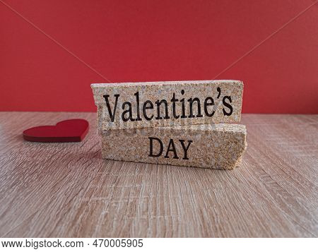 Valentine's Day, The Inscription On The Brick Blocks Of Shell On The Background Of A Red Heart. Beau