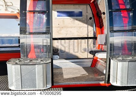 Red Gondola Ski Cable Way Lift Isolated With Open Door And Empty Seats In Goderdzi Ski Resort. Georg