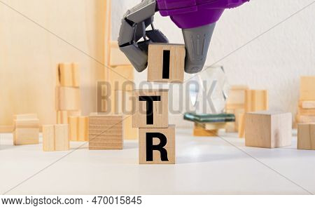 Wooden Blocks With The Inscription Itr Income Tax Return On Office Desk.