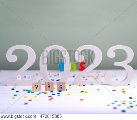 Wooden Cube With Text Vbs (vacation Bible School) 2023 On A White Table. Christian Concept.