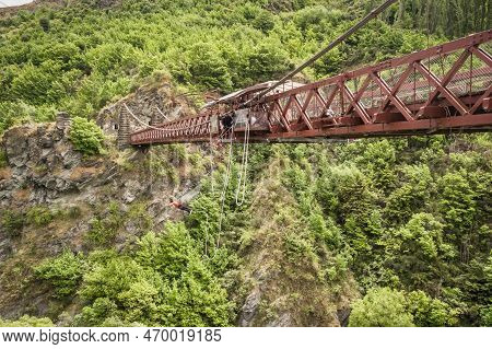Kawarau Bridge, Queenstown, New Zealand - 20th December 2022: A Bungy Jumper Leaps From The Kawarau 