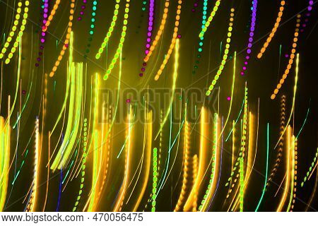 Blurred Abstract Background. Drawing With Light, Garlands With Multi-colored Led Bulbs, Shooting Whi