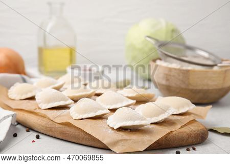Raw Dumplings (varenyky) With Tasty Filling On Light Grey Table, Closeup