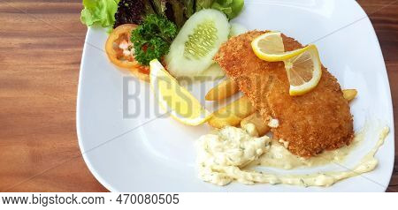 Fried Dolly Fish Steak With Fresh Organic Vegetabl. Green Cabbage, Sliced Cucumber, Tomato And Lemon
