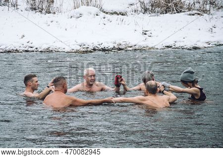 Vilnius, Lithuania - February 03 2023: Group Of People In Circle Ice Bathing Together In The Cold Wa