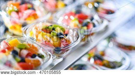 Boxes With Pre-packaged Fruit Salads In A Commercial Fridge