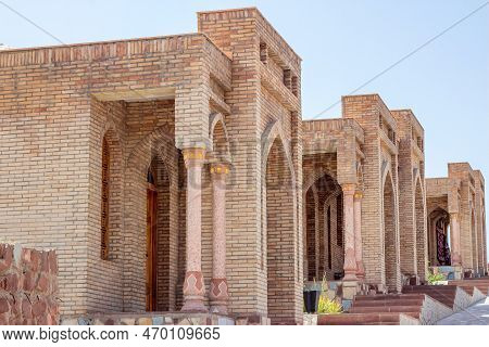 Hisor, Tajikistan - July 31, 2022: Ancient Hisor Fort In Summer Against The Blue Sky.