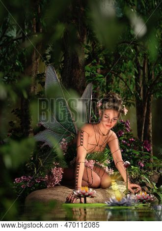 3d Computer Graphics Of A Fairy Kneeling At A Water Lily Pond (not Ai Generated)