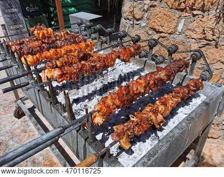 Pork And Lamb Meat Cooked Traditionally On A Grill With Charcoal. Cyprus Souvla.