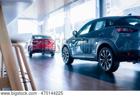 Rearview Car Parked In Luxury Showroom. Car Dealership Office. New Car Parked In Modern Showroom. Au