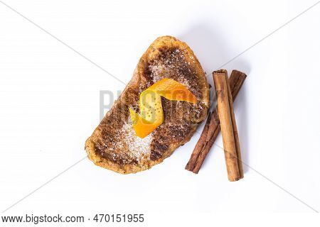 Traditional Homemade Spanish Torrijas Decorated With Cinnamon And Orange Peel Isolated On White Back