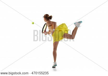 Studio Shot Of Professional Young Female Tennis Player In Sports Uniform Training With Tennis Racket