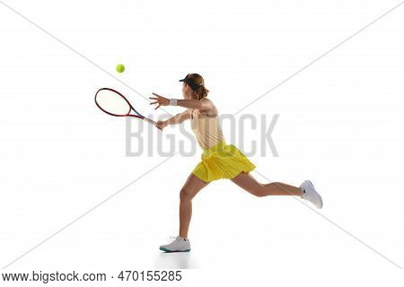 Studio Shot Of Professional Young Female Tennis Player In Sports Uniform Training With Tennis Racket