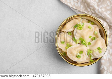 Cooked Dumplings (varenyky) With Tasty Filling And Green Onion On Light Table, Top View. Space For T