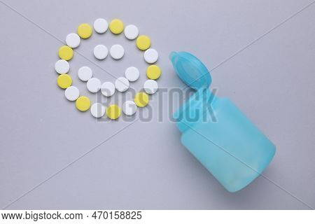 Happy Emoticon Made Of Antidepressants And Medical Bottle On Grey Background, Flat Lay