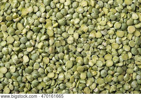 Background Of Green Pea Broken In Half. Green Dry Pea, Top-down Shot. Cooking With Pea
