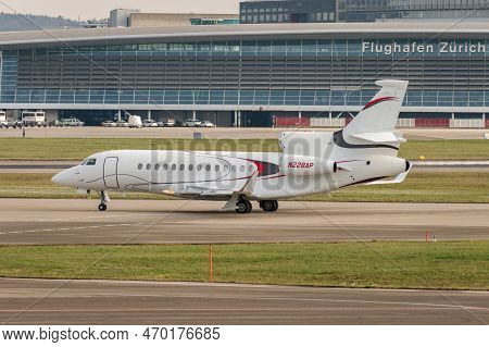 Zurich, Switzerland, January 20,2023 Dessault Falcon 7x Business Aircraft Is Taxiing To Its Takeoff 