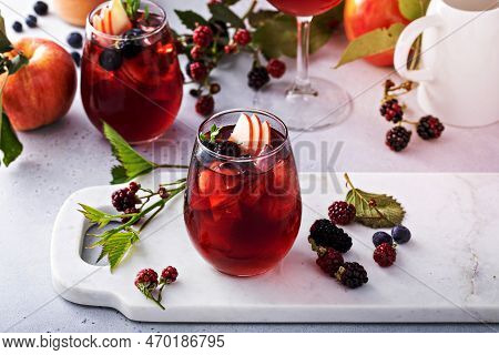 Fall Berry And Apple Sangria In A Glass With Ice, Refreshing Fall Cocktail Or Mocktail Idea