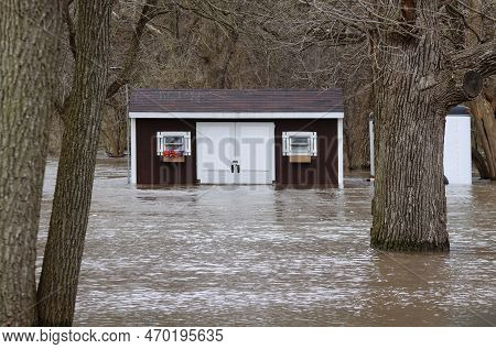A Shed And A Trailer Are Flooded In Spring Floods On The Dupage River In Shorewood, Will County, Ill