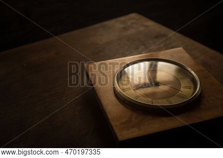 Time Concept. Old Rustic Wall Clock On Old Wooden Table With Copy Space