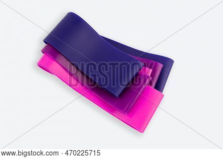Fitness Elastic Band. Woman Showing A Blue Rubber Band. Sport And Healthy Active Lifestyle Concept. 