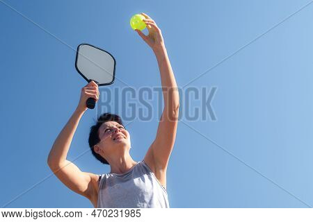 Woman Playing Pickleball Game, Hitting Pickleball Yellow Ball With Paddle, Outdoor Sport Leisure Act