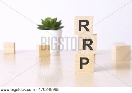 Rrp - Recommended Retail Price - Text On Wooden Cubes On A White Background