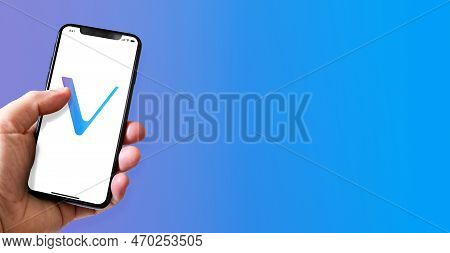 Paris - France - March 15, 2022 : Hand Holding Iphone Smartphone With Vet Vechain Crypto Currency Lo