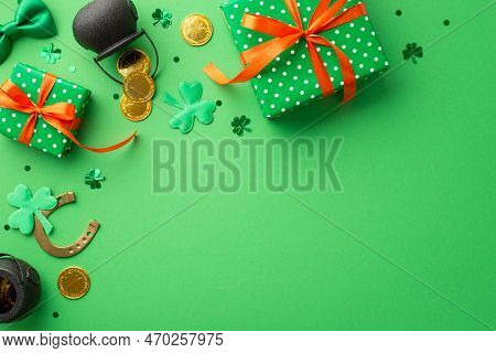 St Patrick's Day Concept. Top View Photo Of Green Present Boxes With Orange Ribbon Bows Pots With Go