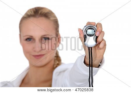 Woman holding stop watch