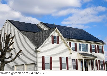 Renewable Clean Green Energy Saving Efficient Photovoltaic Solar Panels On Multiple Gable Suburban H