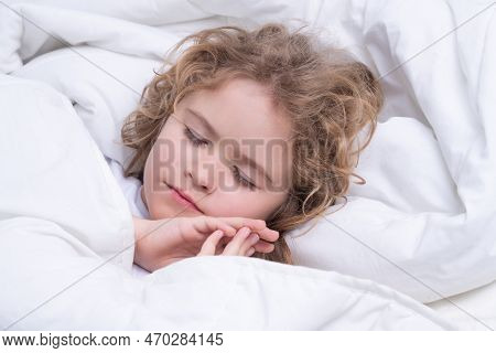 Morning Sleeping. Kid Sleeping In Bed. Child Sleeping In Bed Under Blanket. Kid Lying On Pillow, Chi