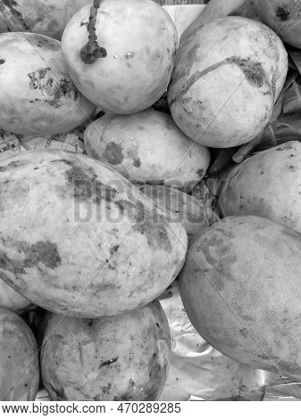 Black And White Mango Fruit Close-up On Sale In The Market Stall