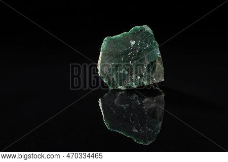 Uncut Green Moss Agate Gem Stone On Black Background With Reflection