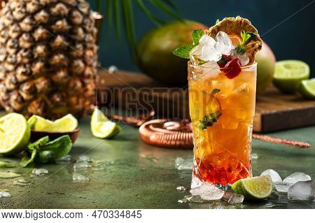 Alcoholic Cocktail With Vodka, Pineapple Juice, Mango, Red Syrup And Ice. Long Drink Or Summer Cold 