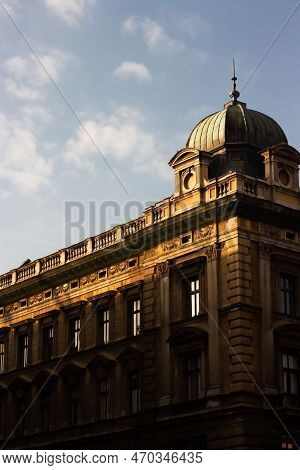 Old Historic House In Europe. European Architecture With Sun And Sky. Vertical Photo