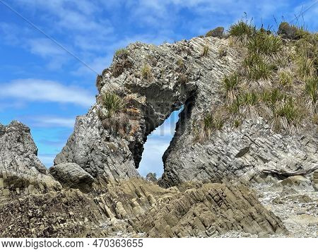 The View Of Natural Rock Arch, Mangawhai Cliff Walk, Auckland, New Zealand.